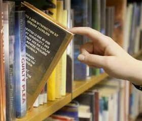 A stock image of a library bookshelf.