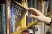A stock image of a library bookshelf.