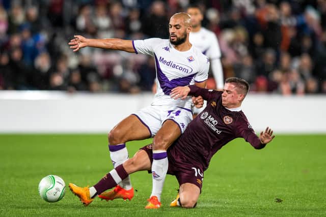 Cammy Devlin and Sofyan Amrabat in action during the Europa Conference League match between Hearts and Fiorentina at Tynecastle. Photo by Mark Scates / SNS Group