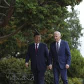 President Joe Biden and China's President President Xi Jinping walk in the gardens at the Filoli Estate in Woodside, Caliornia, Wednesday, on the sidelines of the Asia-Pacific Economic Cooperative conference.