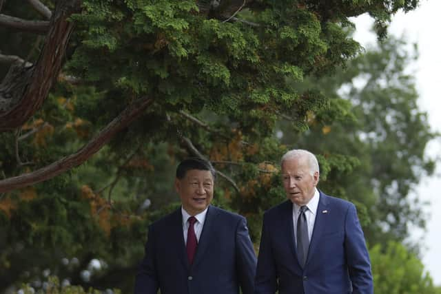 President Joe Biden and China's President President Xi Jinping walk in the gardens at the Filoli Estate in Woodside, Caliornia, Wednesday, on the sidelines of the Asia-Pacific Economic Cooperative conference.