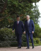 President Joe Biden and China's President President Xi Jinping walk in the gardens at the Filoli Estate in Woodside, Caliornia, Wednesday, on the sidelines of the Asia-Pacific Economic Cooperative conference.