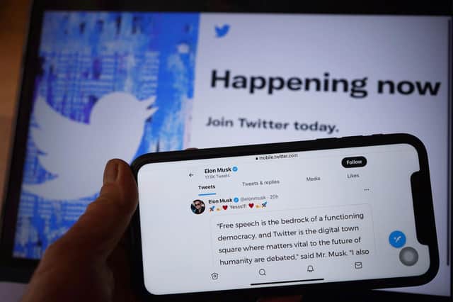 Twitter social media app displaying a tweet by Elon Musk on a mobile phone, as Elon Musk has said verified accounts on Twitter which change their name to impersonate others will be permanently banned from the site.