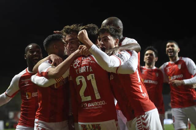 Braga's players celebrate a goal by Andre Horta during their impressive 3-2 win over Benfica in a Portuguese Primeira Liga match last Friday night. (Photo by MIGUEL RIOPA/AFP via Getty Images)