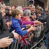 King Charles III greets members of the public as he arrives at an official council meeting at the City Chambers in Dunfermline