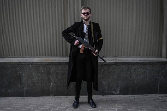 Civilians, like Ukrainian politician Svyatoslav Yurash, 26, have taken up arms in defence of their country (Picture: Aris Messinis/AFP via Getty Images)