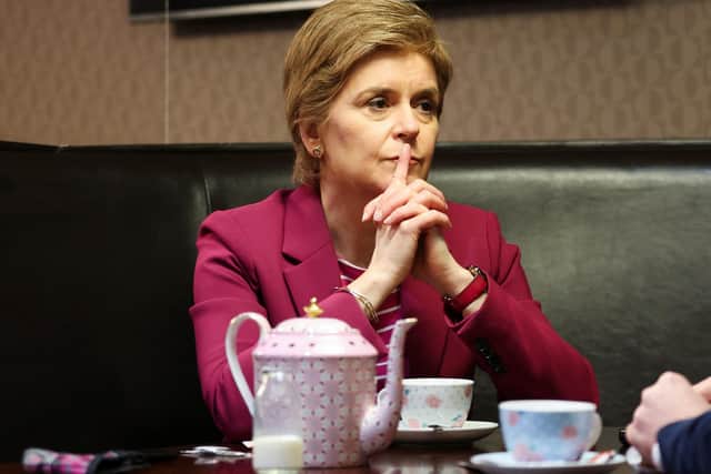 First Minister Nicola Sturgeon has tea at a cafe in Arbroath while on the campaign trail for the coming local elections. Picture: Russell Cheyne - Pool/Getty Images