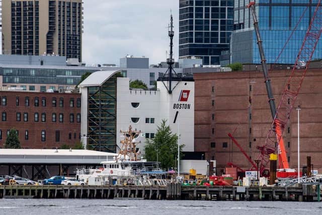 Equipment and boats fill the docks at the the US Coast Guard Station Boston in Boston, Massachusetts. A submersible vessel used to take tourists to see the wreckage of the Titanic in the North Atlantic has gone missing, triggering a search-and-rescue operation, the US Coast Guard said.