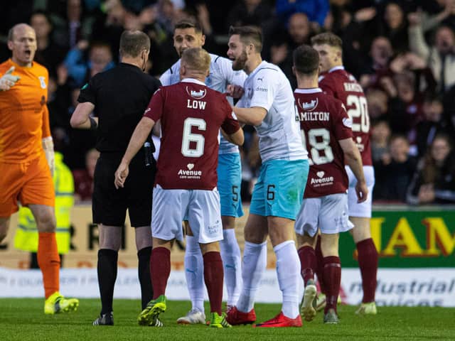 Inverness' Danny Devine protests his sending off by referee Willie Collum during the victory over Arbroath.