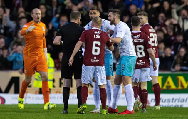Inverness' Danny Devine protests his sending off by referee Willie Collum during the victory over Arbroath.