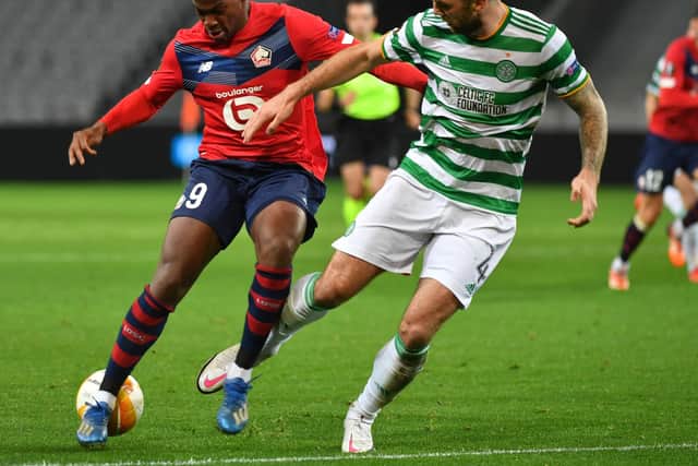 Lille's French forward Jonathan David vies for the ball with Celtic's defender Shane Duffy. Photo by DENIS CHARLET/AFP via Getty Images
