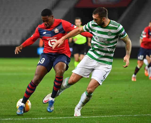 Lille's French forward Jonathan David vies for the ball with Celtic's defender Shane Duffy. Photo by DENIS CHARLET/AFP via Getty Images