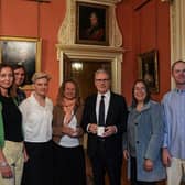 Prime Minister Keir Starmer with families involved in the consultation process for online restrictions, before holding a press conference at Downing Street this week to announce government action to protect children online. (Picture: Carlos Jasso / Pool/ AFP via Getty Images)