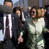 Speaker of the House Nancy Pelosi walks through crowds at the COP27 climate summit in Egypt. Picture: AP Photo/Peter Dejong