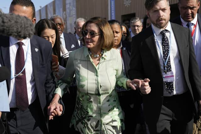 Speaker of the House Nancy Pelosi walks through crowds at the COP27 climate summit in Egypt. Picture: AP Photo/Peter Dejong