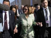 Speaker of the House Nancy Pelosi walks through crowds at the COP27 climate summit in Egypt. Picture: AP Photo/Peter Dejong