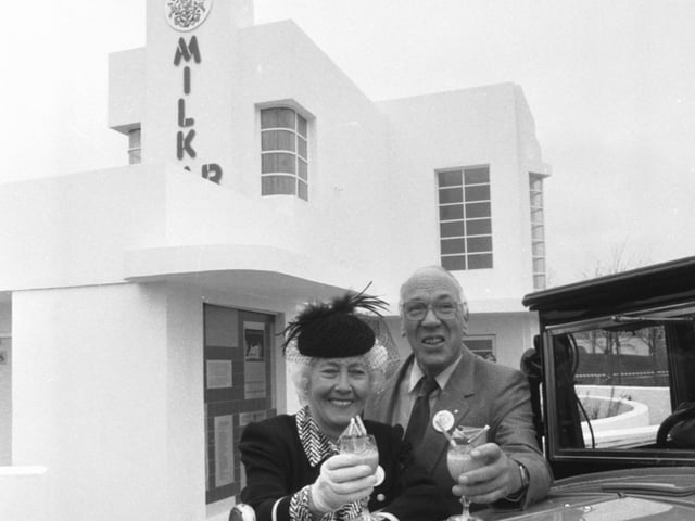 Dr George Roberts and wife Jean pose with cocktails beside their Morris Cowley, parked outside their 1930s-style Broom Milk Bar at  the Glasgow Garden Festival in April 1988.