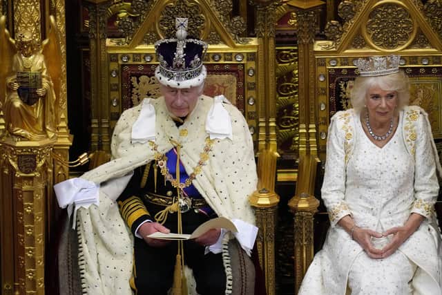 King Charles III sits besides Queen Camilla during the State Opening of Parliament, in the House of Lords at the Palace of Westminster in London.