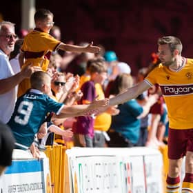 Motherwell's Stephen O'Donnell with fans after the 3-2 win over Queen of the South in the Premier Sports Cup. (Photo by Craig Foy / SNS Group)