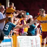 Motherwell's Stephen O'Donnell with fans after the 3-2 win over Queen of the South in the Premier Sports Cup. (Photo by Craig Foy / SNS Group)