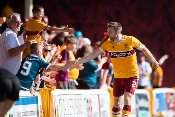 Motherwell's Stephen O'Donnell with fans after the 3-2 win over Queen of the South in the Premier Sports Cup. (Photo by Craig Foy / SNS Group)