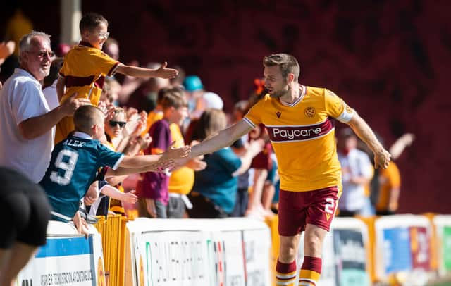 Motherwell's Stephen O'Donnell with fans after the 3-2 win over Queen of the South in the Premier Sports Cup. (Photo by Craig Foy / SNS Group)