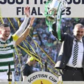 Celtic manager Ange Posetcoglou lifts the Scottish Cup trophy alongside captain Callum McGregor. (Photo by Rob Casey / SNS Group)