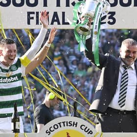 Celtic manager Ange Posetcoglou lifts the Scottish Cup trophy alongside captain Callum McGregor. (Photo by Rob Casey / SNS Group)
