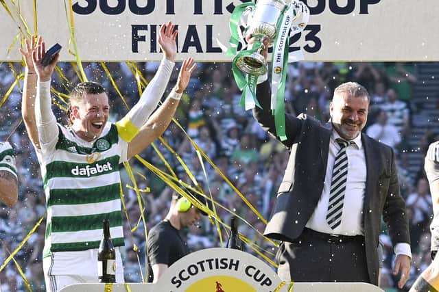 Celtic manager Ange Posetcoglou lifts the Scottish Cup trophy alongside captain Callum McGregor. (Photo by Rob Casey / SNS Group)