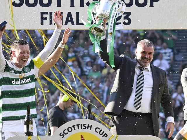 Celtic manager Ange Posetcoglou lifts the Scottish Cup trophy alongside captain Callum McGregor. (Photo by Rob Casey / SNS Group)