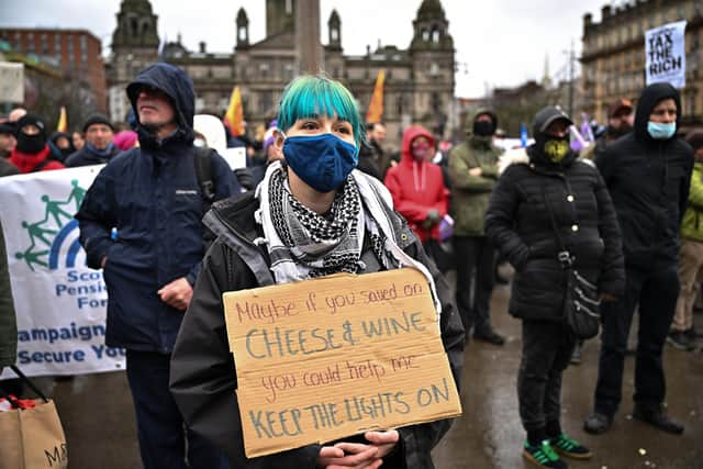 One protester poked fun at Downing Street, and referenced the partygate scandal on her placard. (Photo by Jeff J Mitchell/Getty Images)