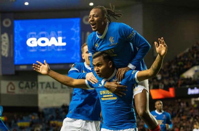 Joe Aribo leaps on top of Alfredo Morelos as they celebrate Rangers' second goal in the 2-0 win over Sparta Prague. (Photo by Alan Harvey / SNS Group)