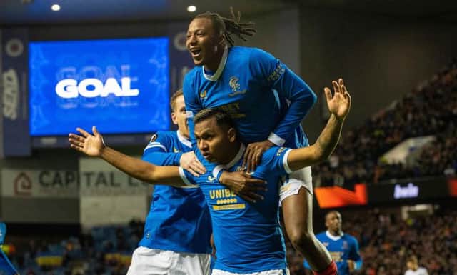 Joe Aribo leaps on top of Alfredo Morelos as they celebrate Rangers' second goal in the 2-0 win over Sparta Prague. (Photo by Alan Harvey / SNS Group)