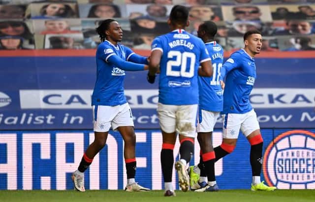Joe Aribo celebrates with James Tavernier after scoring to make it 3-0 during a Scottish Premiership match between Rangers and Ross County at Ibrox, on January 23, 2021, in Glasgow, Scotland. (Photo by Rob Casey / SNS Group)