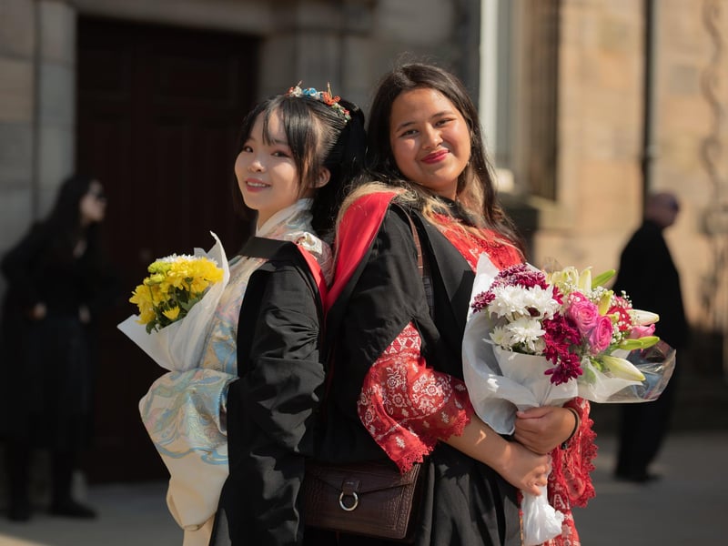 Jasmin Zheng and Sherri Makhijani in national dress, representing China and Indonesia respectively.