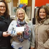 Shona Watson of Buchan Giving Tree SCIO receives the cheque from Sheena Gordon and Alison Morgan of Apex.