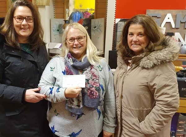 Shona Watson of Buchan Giving Tree SCIO receives the cheque from Sheena Gordon and Alison Morgan of Apex.