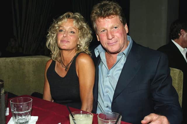 Ryan O'Neal with partner Farrah Fawcett in 2003 in Los Angeles (Picture: Kevin Winter/Getty Images)