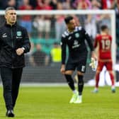 Hibs manager Nick Montgomery applauds the supporters after Hibs' 4-0 defeat by Aberdeen at Easter Road.