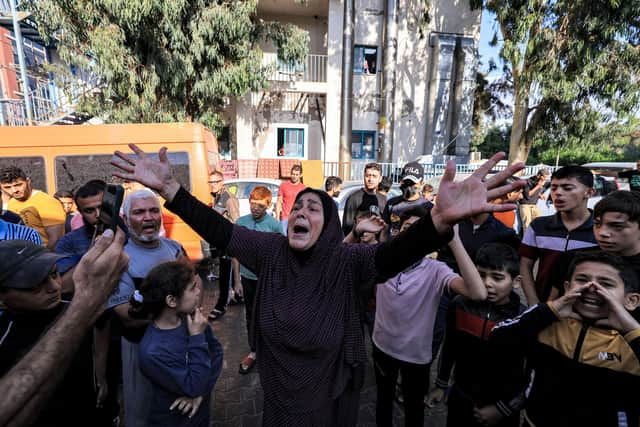 People gather at the site of the Ahli Arab Hospital in Gaza City after a deadly explosion (Picture: Mahmud Hams/AFP via Getty Images)