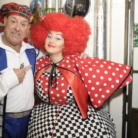 Andy Gray as Buttons and his daughter Clare as a Wicked Sister meet backstage during Cinderella at the King's