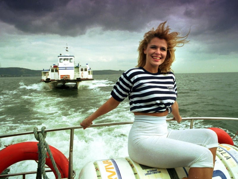 Jacqui Ward on one of Forth Ferries vessels doing the Granton to Burntisland run as a storm gathers on the company's first birthday in April 1992