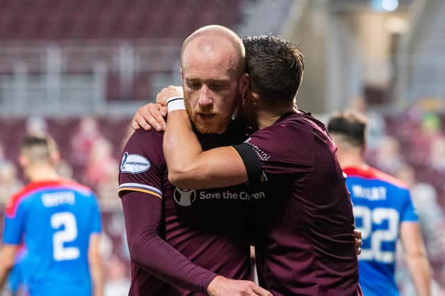 Hearts' Liam Boyce (left) celebrates making it 2-0 with Olly Lee. (Photo by Ross Parker / SNS Group)