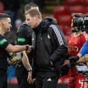 Aberdeen manager Barry Robson speaks to referee Nick Walsh at full time after the 1-1 draw with Rangers at Pittodrie. (Photo by Craig Williamson / SNS Group)