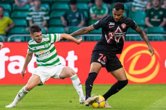 Celtic's Greg Taylor (left) competes with Junior Brumado during a Champions League qualifier between Celtic and FC Midtjylland at Celtic Park on July 20, 2021, in Glasgow, Scotland (Photo by Ross Parker / SNS Group)
