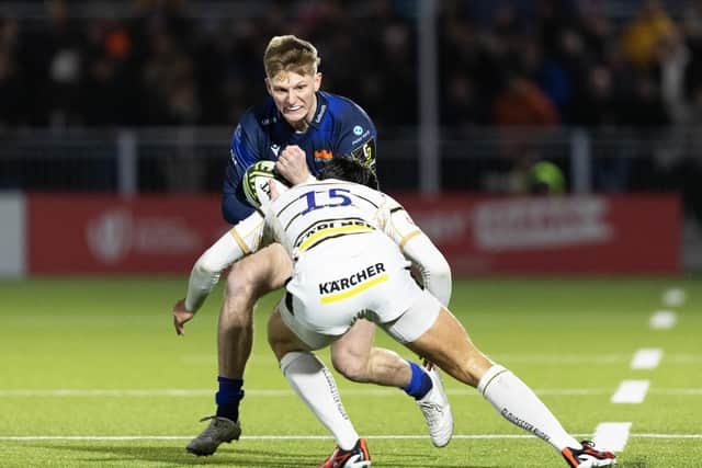 Edinburgh's Harry Paterson is tackled by Gloucester's Louis Rees-Zammit during the EPCR Challenge Cup match at Hive Stadium. Paterson has been called into Scotland's Six Nations squad. (Photo by Ross Parker / SNS Group)