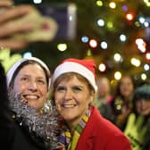 SNP leader Nicola Sturgeon with Alison Thewliss having a selfie taken during a visit to Gorbals Parish Church