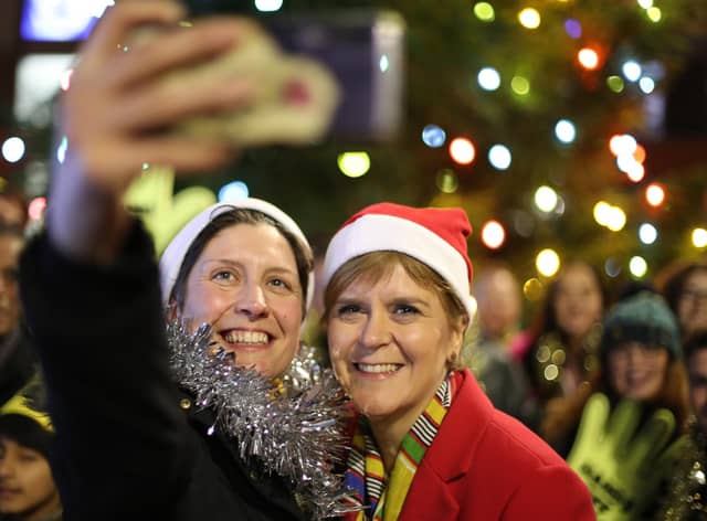 SNP leader Nicola Sturgeon with Alison Thewliss having a selfie taken during a visit to Gorbals Parish Church