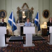 Nicola Sturgeon announces the new government deal, flanked by Green co-leaders Patrick Harvie and Lorna Slater
