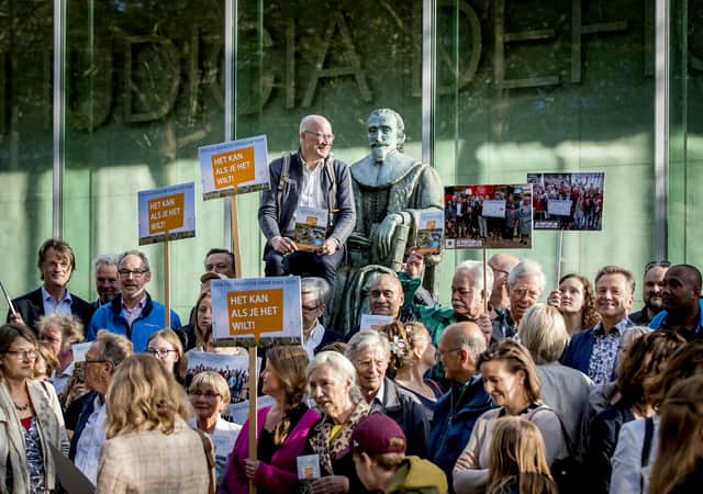Supporters of Marjan Minnesma (not pictured) director of Urgenda, gather outside the Supreme Court in The Hague on May 24, 2019. Photo: KOEN VAN WEEL/AFP via Getty Images